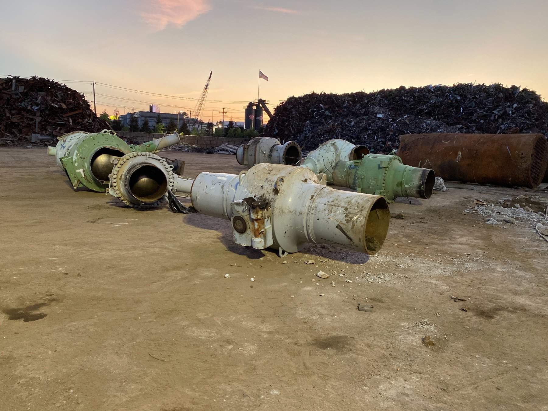 Large oversized industrial ball valves staged for torch processing